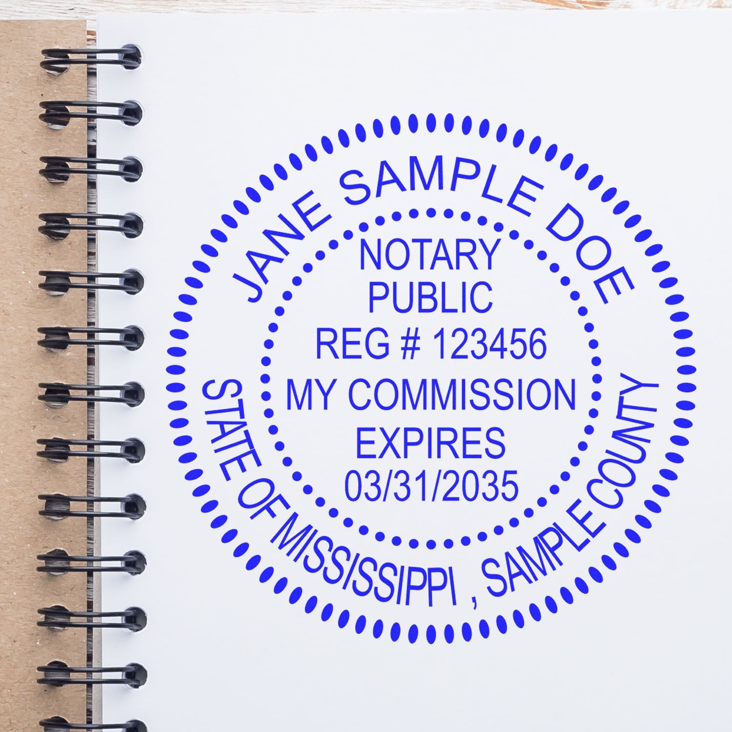 Slim Pre-Inked Round Notary Stamp for Mississippi in use photo showing a stamped imprint of the Slim Pre-Inked Round Notary Stamp for Mississippi