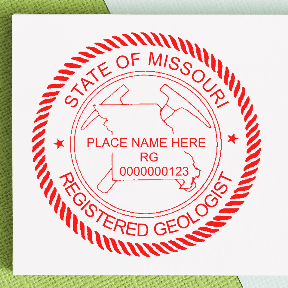 An in use photo of the Missouri Professional Geologist Seal Stamp showing a sample imprint on a cardstock
