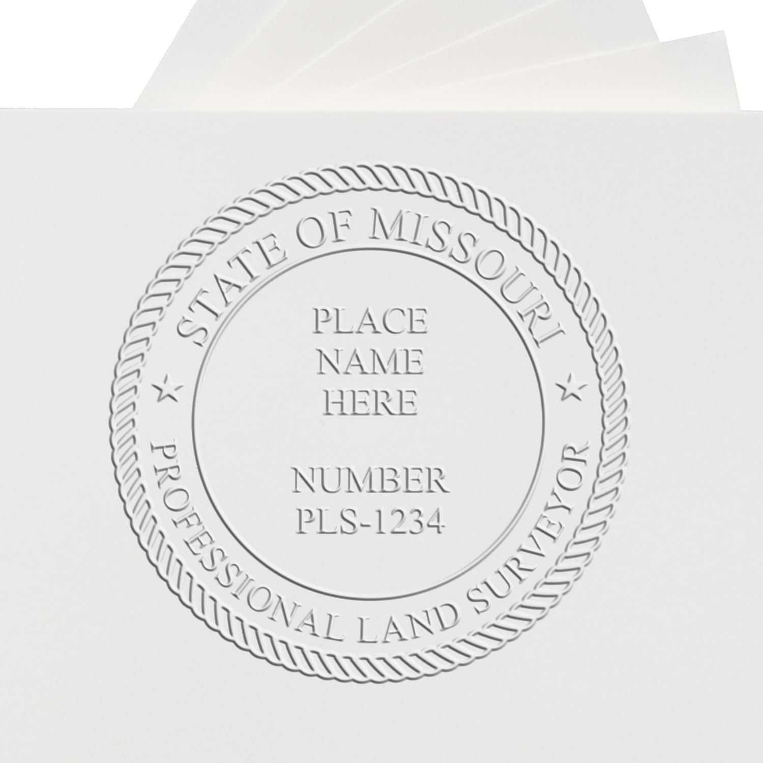 Another Example of a stamped impression of the Heavy Duty Cast Iron Missouri Land Surveyor Seal Embosser on a piece of office paper.