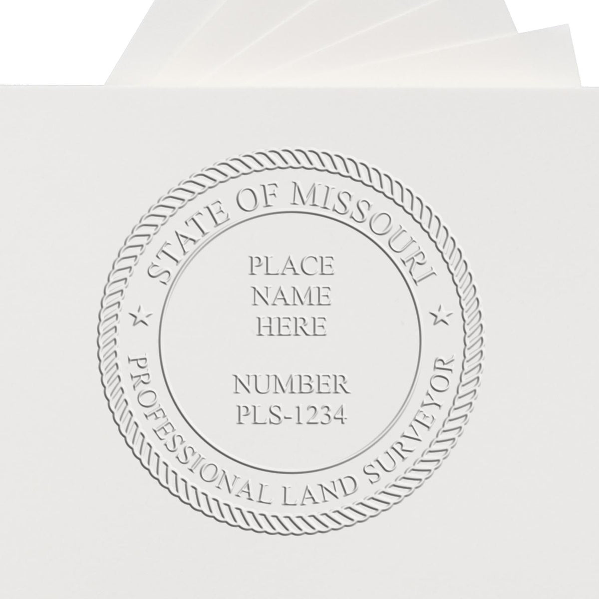 An alternative view of the Heavy Duty Cast Iron Missouri Land Surveyor Seal Embosser stamped on a sheet of paper showing the image in use
