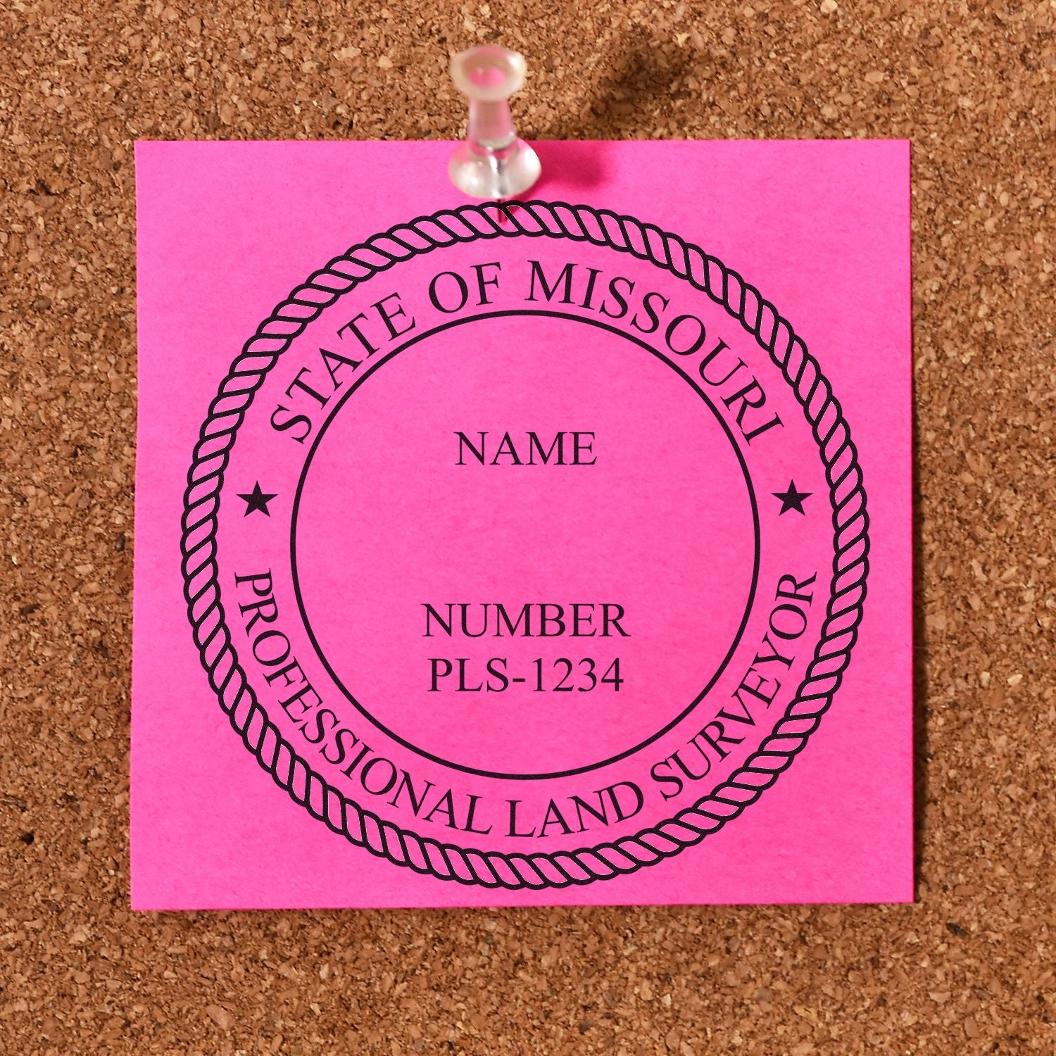 Missouri Land Surveyor Seal Stamp, MO PLS Stamp, displayed on a pink note pinned to a corkboard.