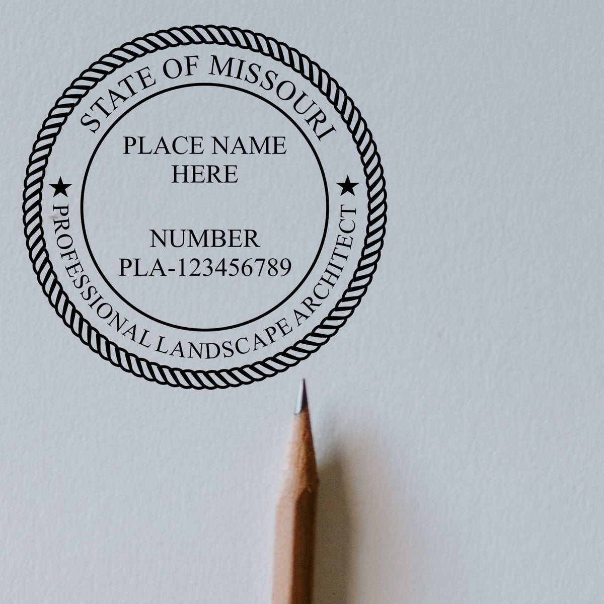 A lifestyle photo showing a stamped image of the Digital Missouri Landscape Architect Stamp on a piece of paper