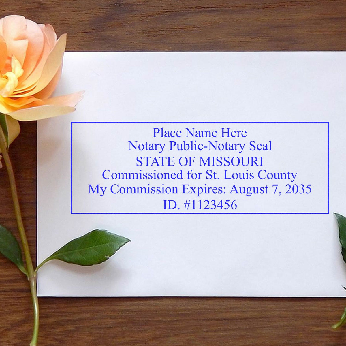 A lifestyle photo showing a stamped image of the Wooden Handle Missouri Rectangular Notary Public Stamp on a piece of paper