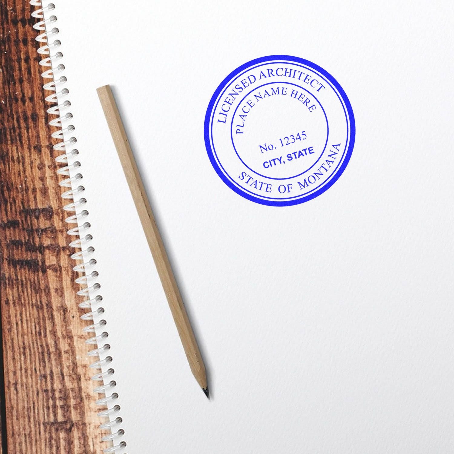 Digital Montana Architect Stamp, Electronic Seal for Montana Architect, displayed on white paper next to a pencil and notebook.