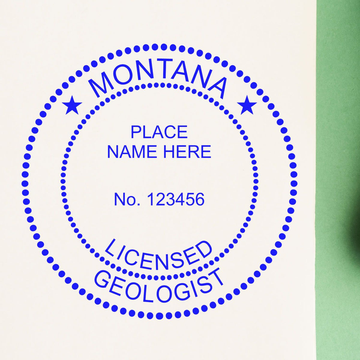 An alternative view of the Slim Pre-Inked Montana Professional Geologist Seal Stamp stamped on a sheet of paper showing the image in use