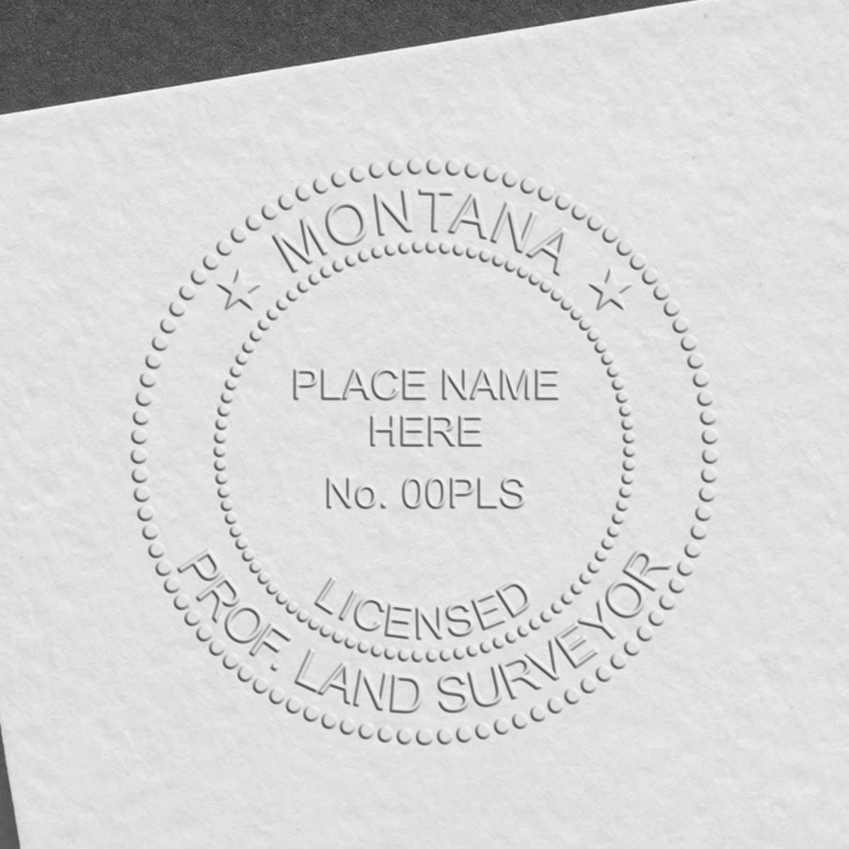 A photograph of the State of Montana Soft Land Surveyor Embossing Seal stamp impression reveals a vivid, professional image of the on paper.