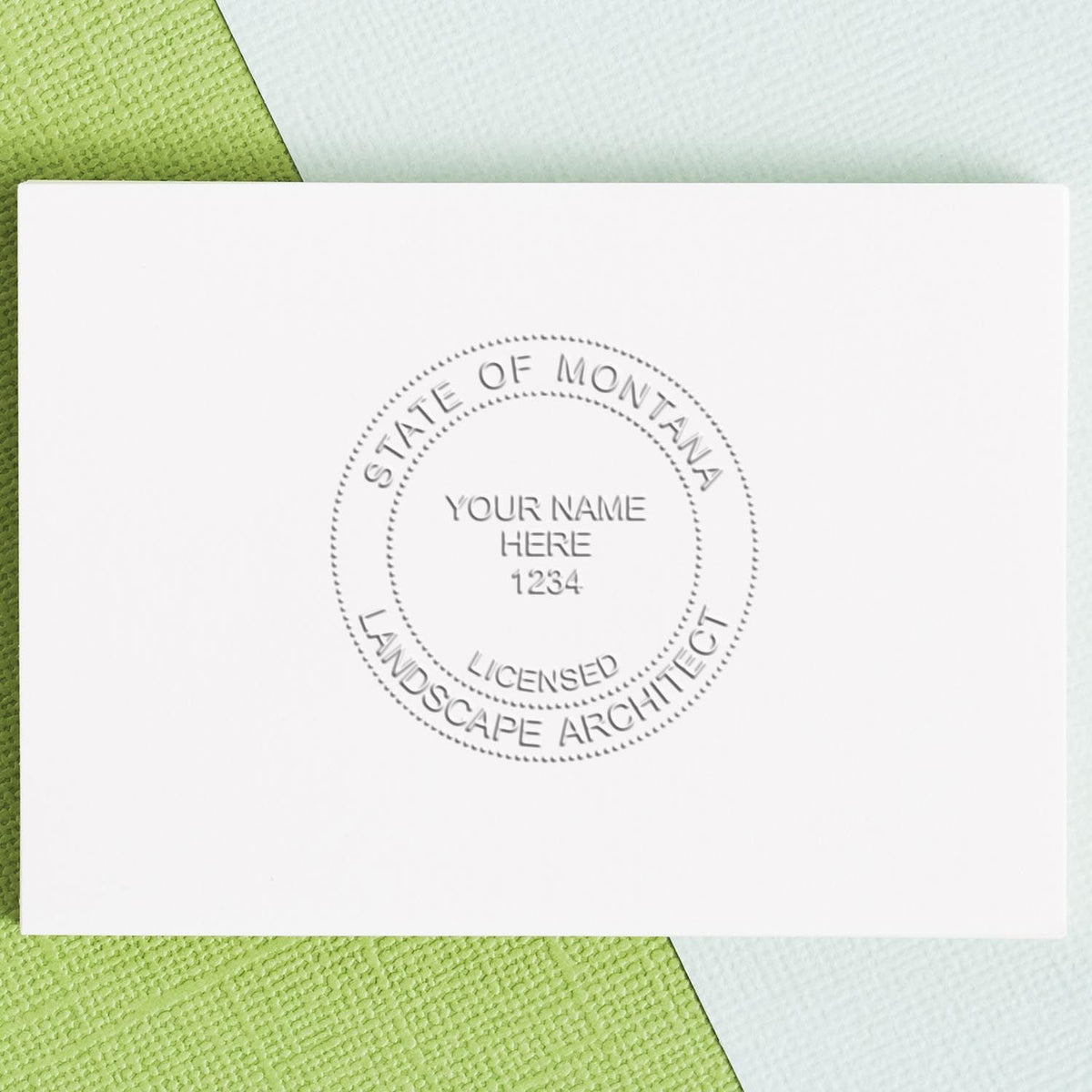 An alternative view of the Hybrid Montana Landscape Architect Seal stamped on a sheet of paper showing the image in use