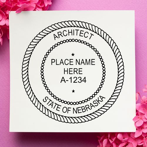 Self Inking Nebraska Architect Stamp on a pink background with flowers, displaying a customizable seal for architects in Nebraska.