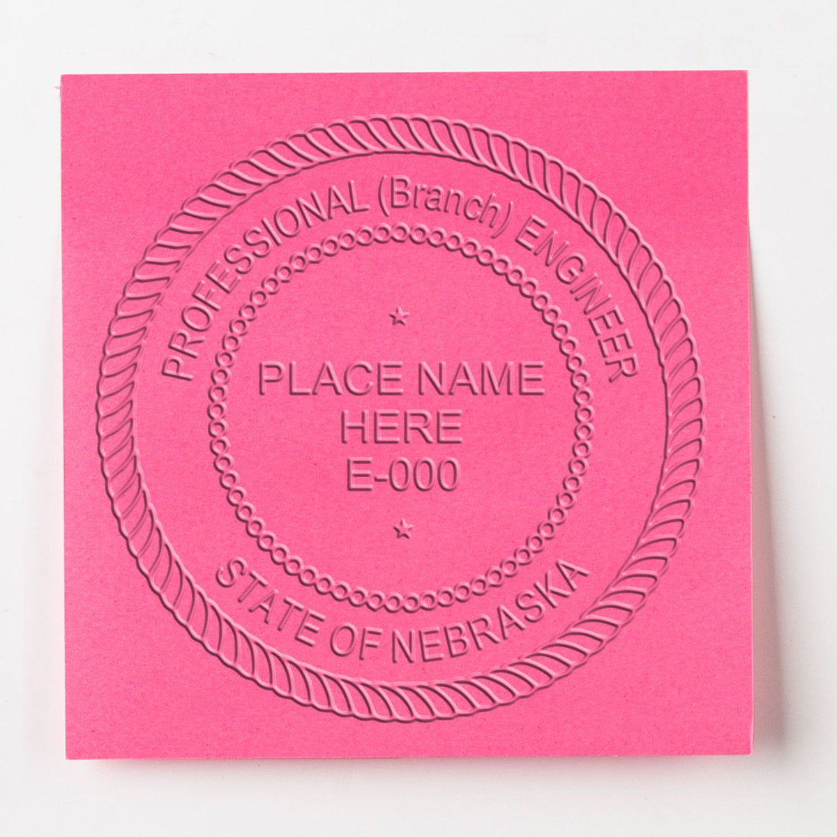 An alternative view of the Long Reach Nebraska PE Seal stamped on a sheet of paper showing the image in use