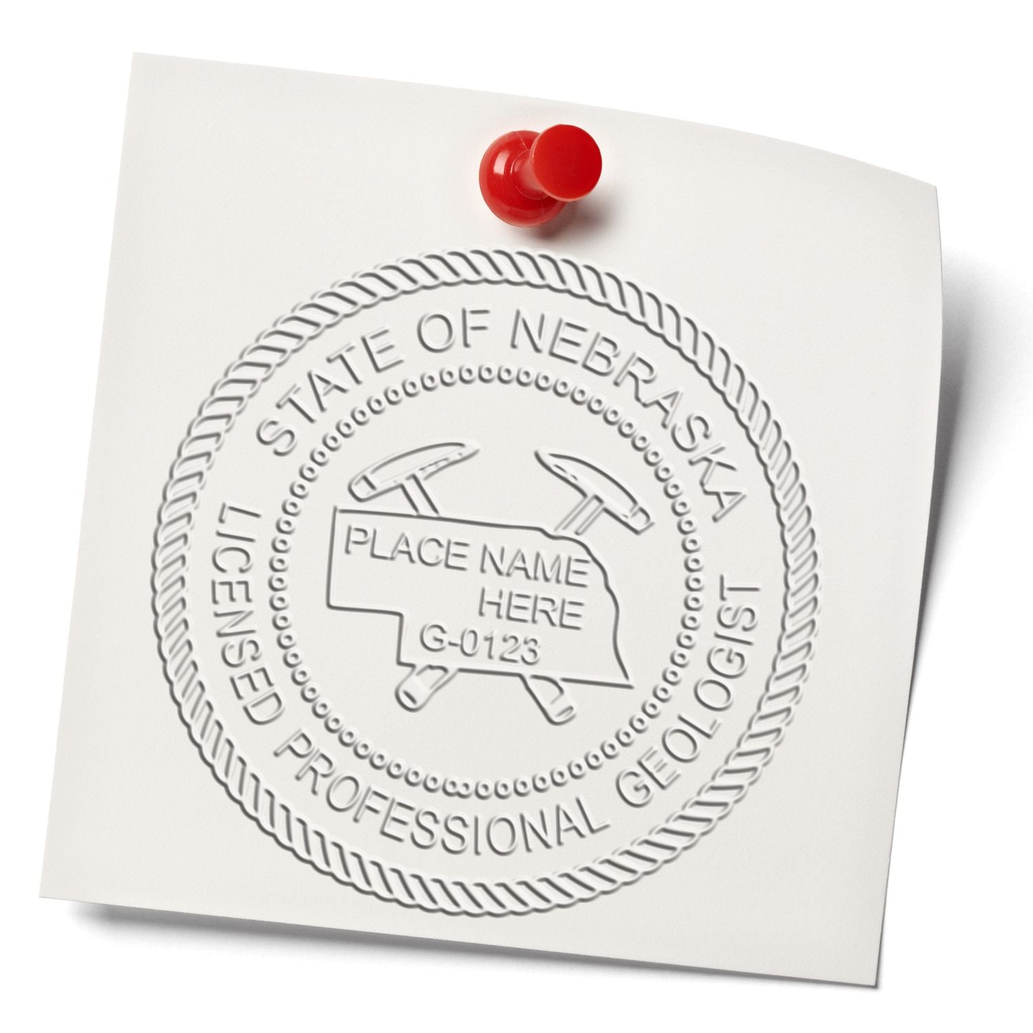 An in use photo of the State of Nebraska Extended Long Reach Geologist Seal showing a sample imprint on a cardstock