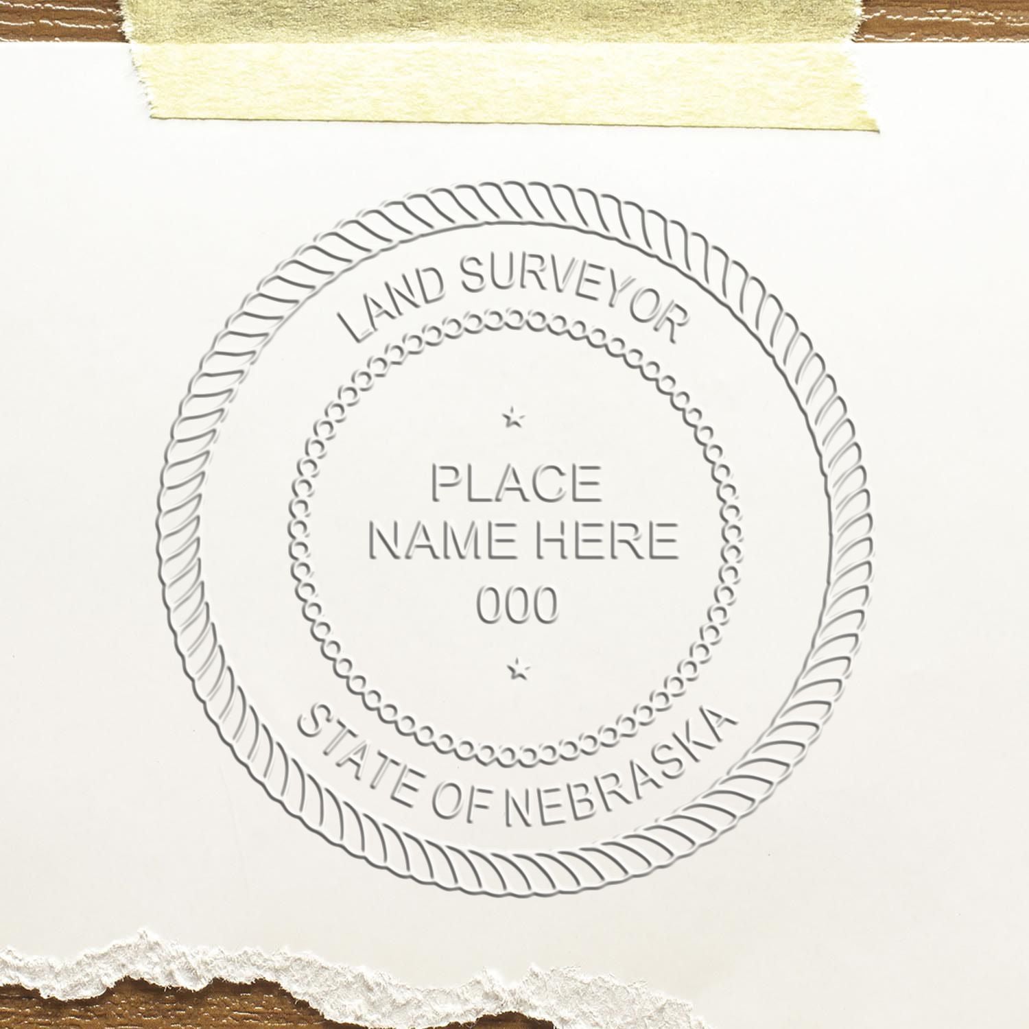 The main image for the Handheld Nebraska Land Surveyor Seal depicting a sample of the imprint and electronic files
