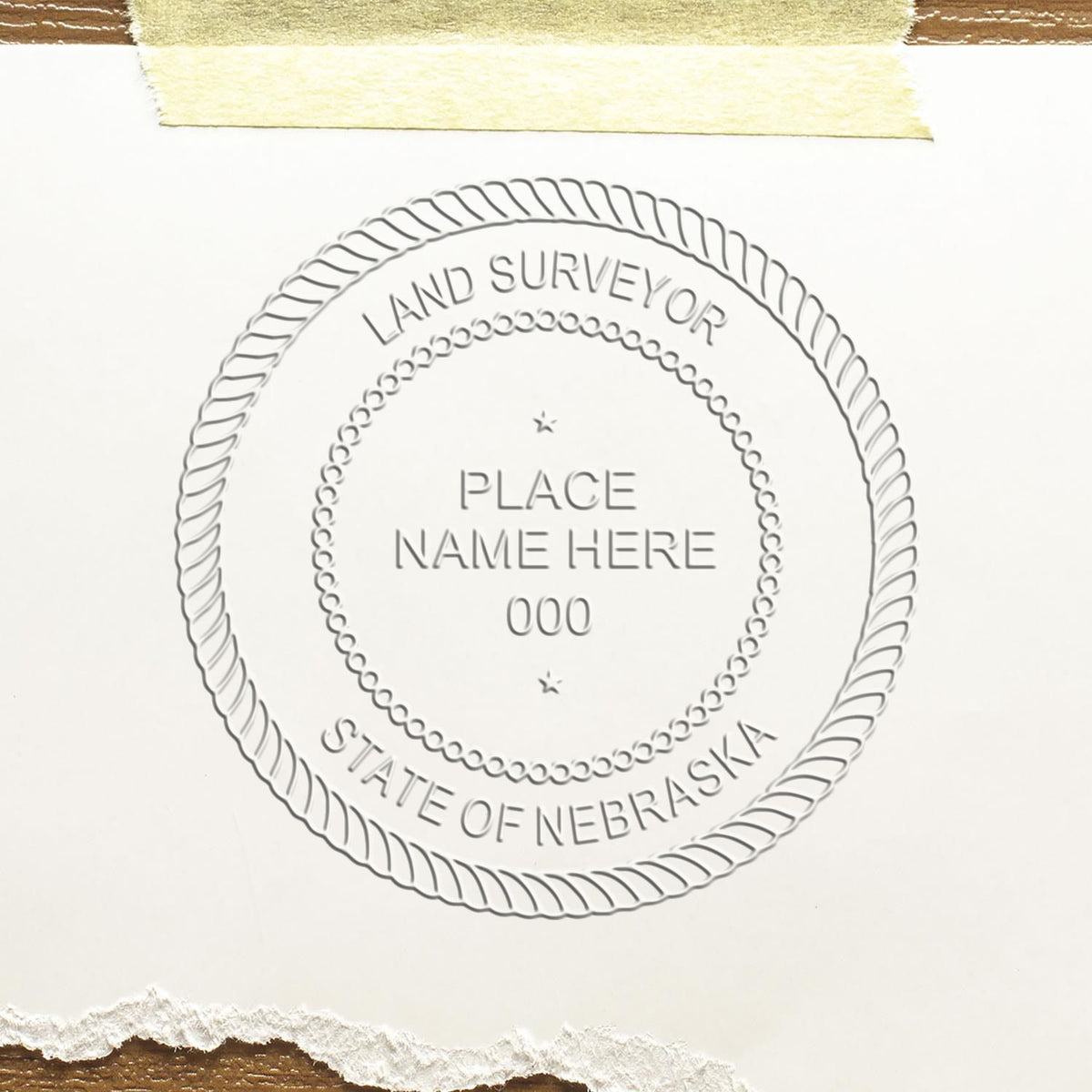 A stamped impression of the Nebraska Desk Surveyor Seal Embosser in this stylish lifestyle photo, setting the tone for a unique and personalized product.