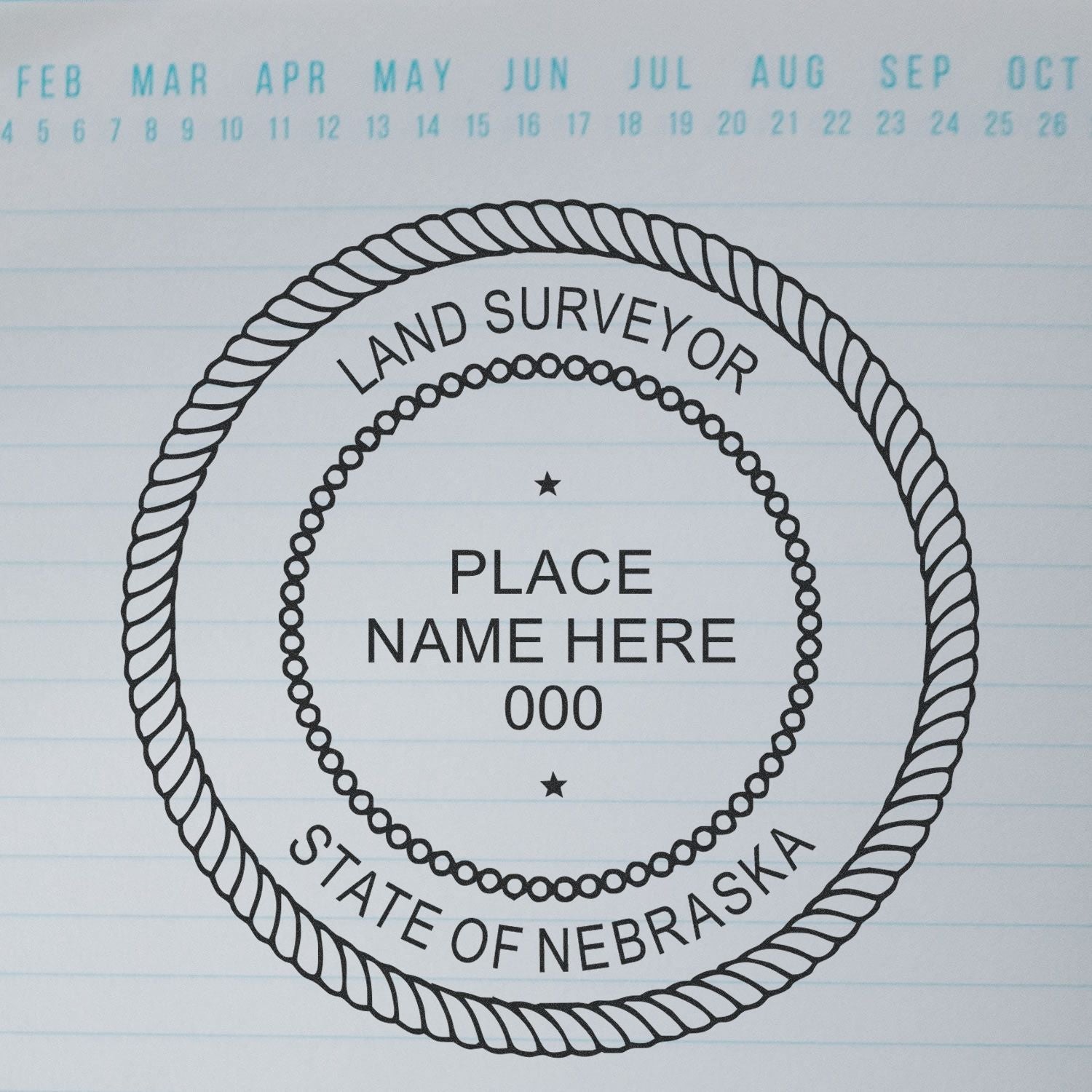 Self Inking Nebraska Land Surveyor Stamp on lined paper with a calendar header showing months from February to October.