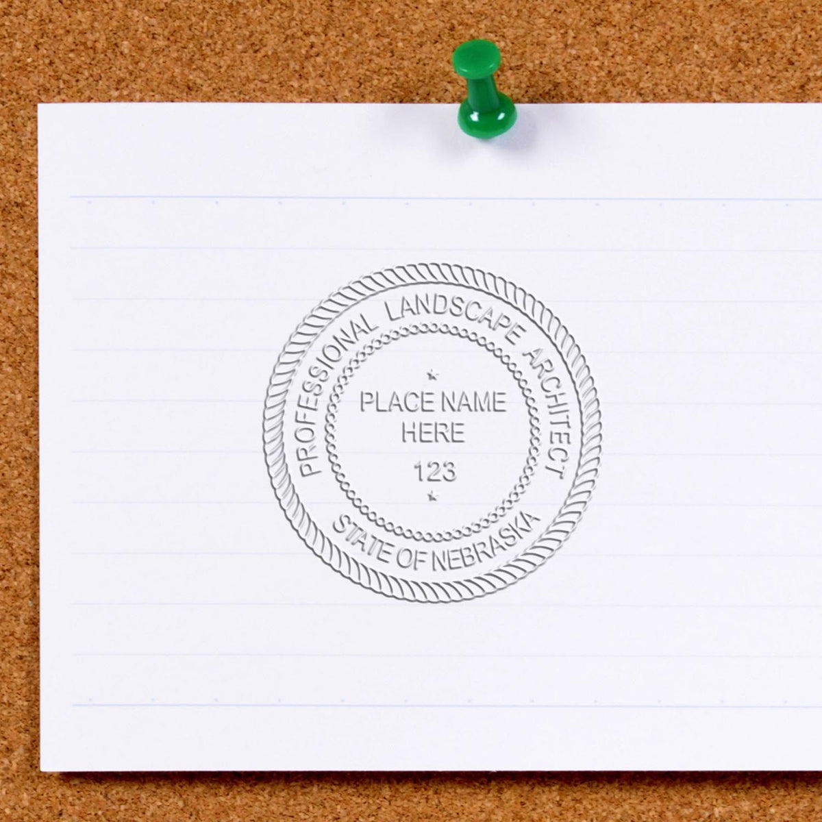 An alternative view of the Hybrid Nebraska Landscape Architect Seal stamped on a sheet of paper showing the image in use