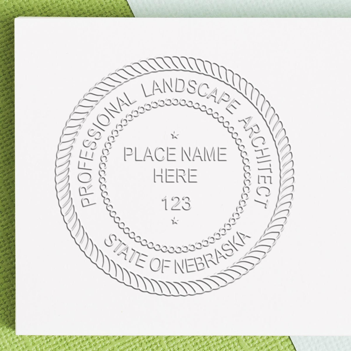 A stamped imprint of the Gift Nebraska Landscape Architect Seal in this stylish lifestyle photo, setting the tone for a unique and personalized product.