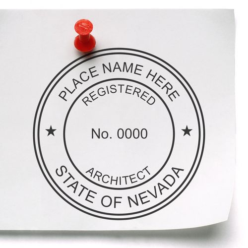 Image of a white paper with a red pushpin displaying the Premium MaxLight Pre-Inked Nevada Architectural Stamp, showing a customizable seal design.