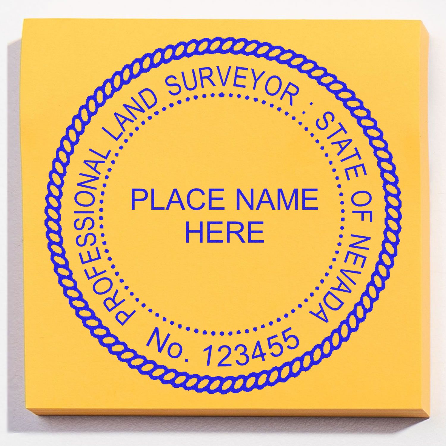 Self Inking Nevada Land Surveyor Stamp with customizable text, blue ink on a yellow background.