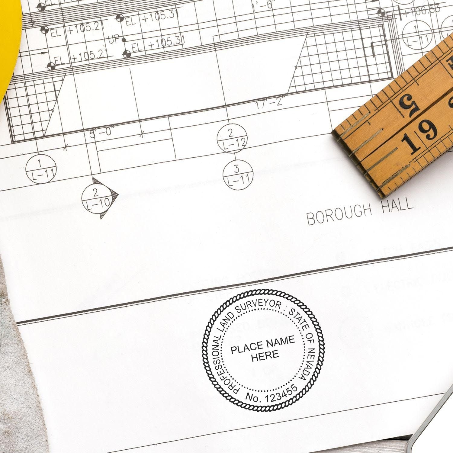 Digital Nevada Land Surveyor Stamp, Electronic Seal for Nevada Land Surveyor, stamped on a blueprint with a ruler and pencil nearby.