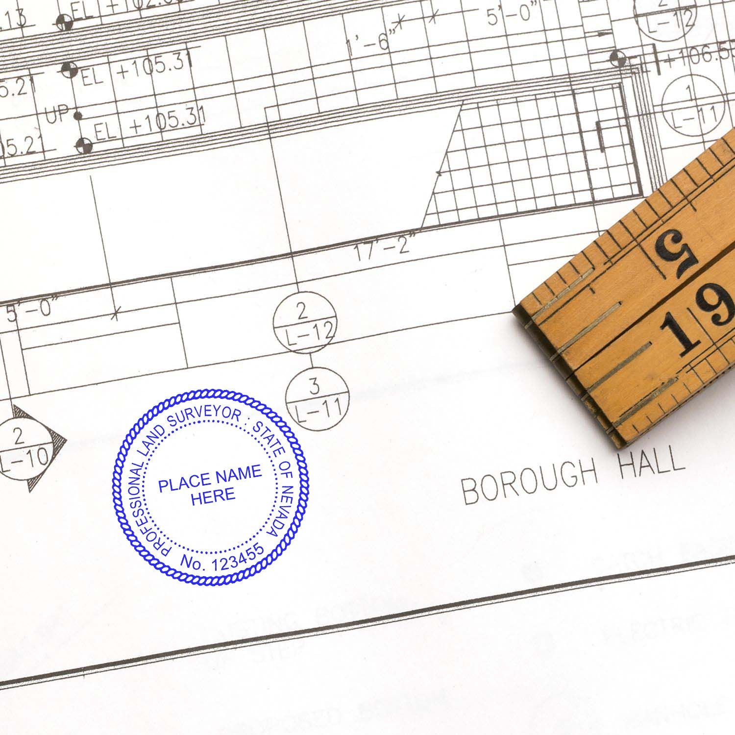 Premium MaxLight Pre-Inked Nevada Surveyors Stamp used on a technical drawing with a ruler nearby.