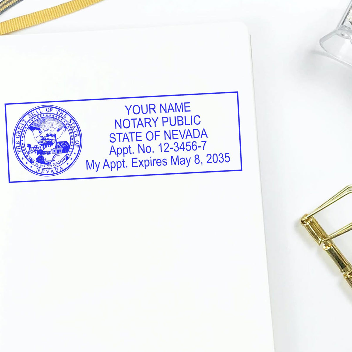 A lifestyle photo showing a stamped image of the Wooden Handle Nevada State Seal Notary Public Stamp on a piece of paper