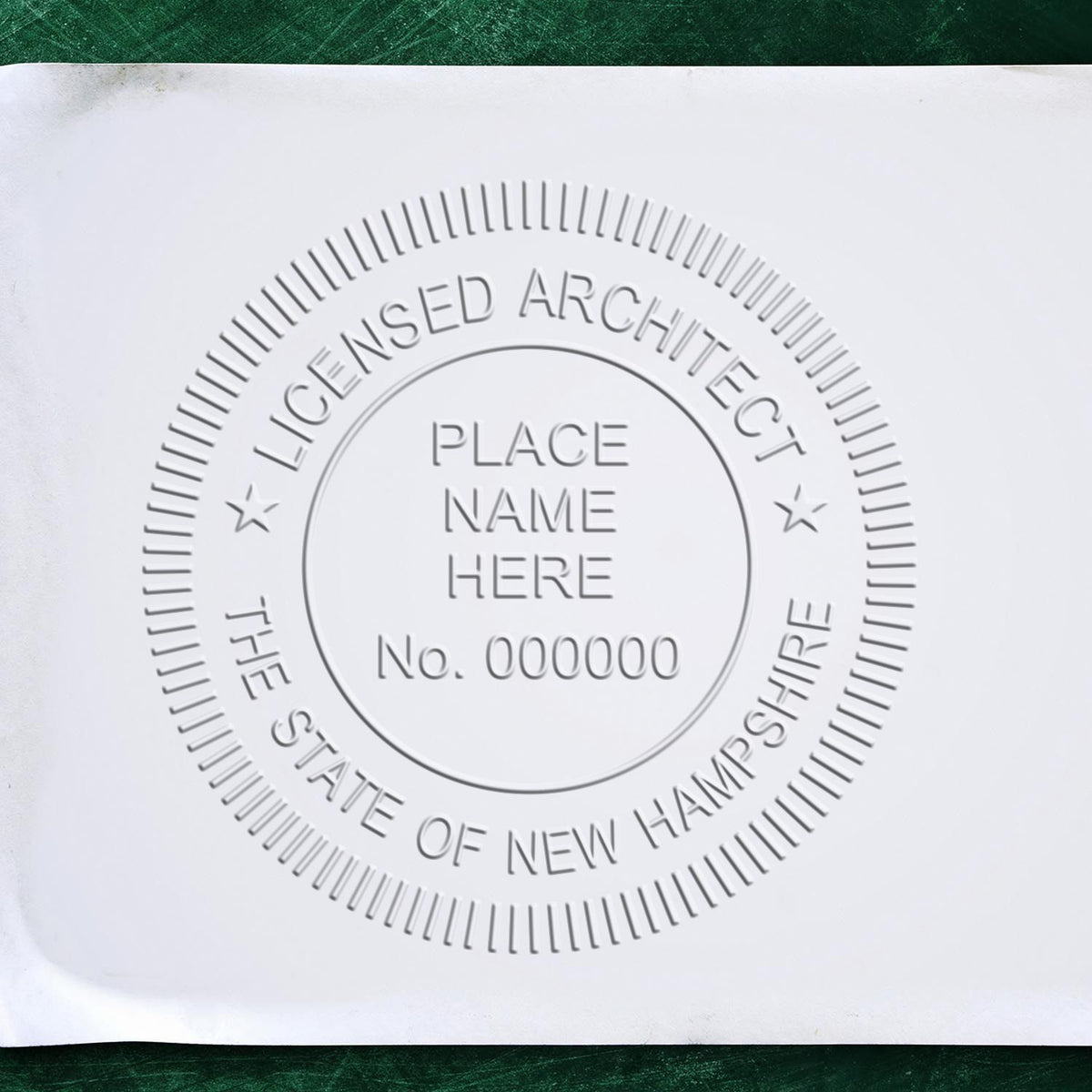 A lifestyle photo showing a stamped image of the Handheld New Hampshire Architect Seal Embosser on a piece of paper