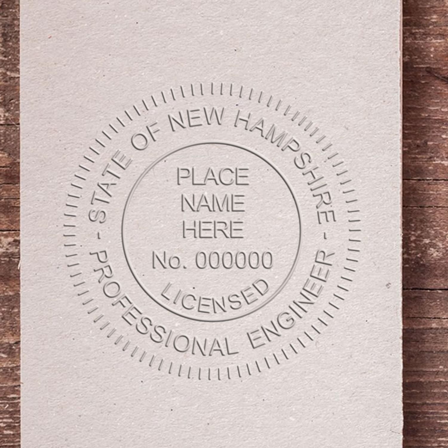 A stamped impression of the New Hampshire Engineer Desk Seal in this stylish lifestyle photo, setting the tone for a unique and personalized product.