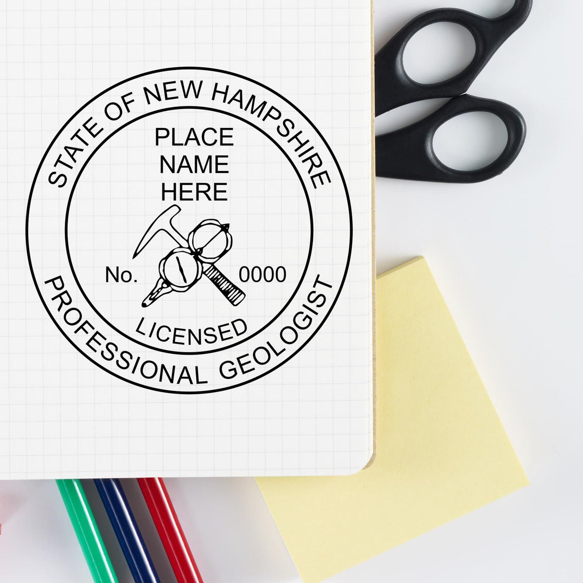 A lifestyle photo showing a stamped image of the Slim Pre-Inked New Hampshire Professional Geologist Seal Stamp on a piece of paper