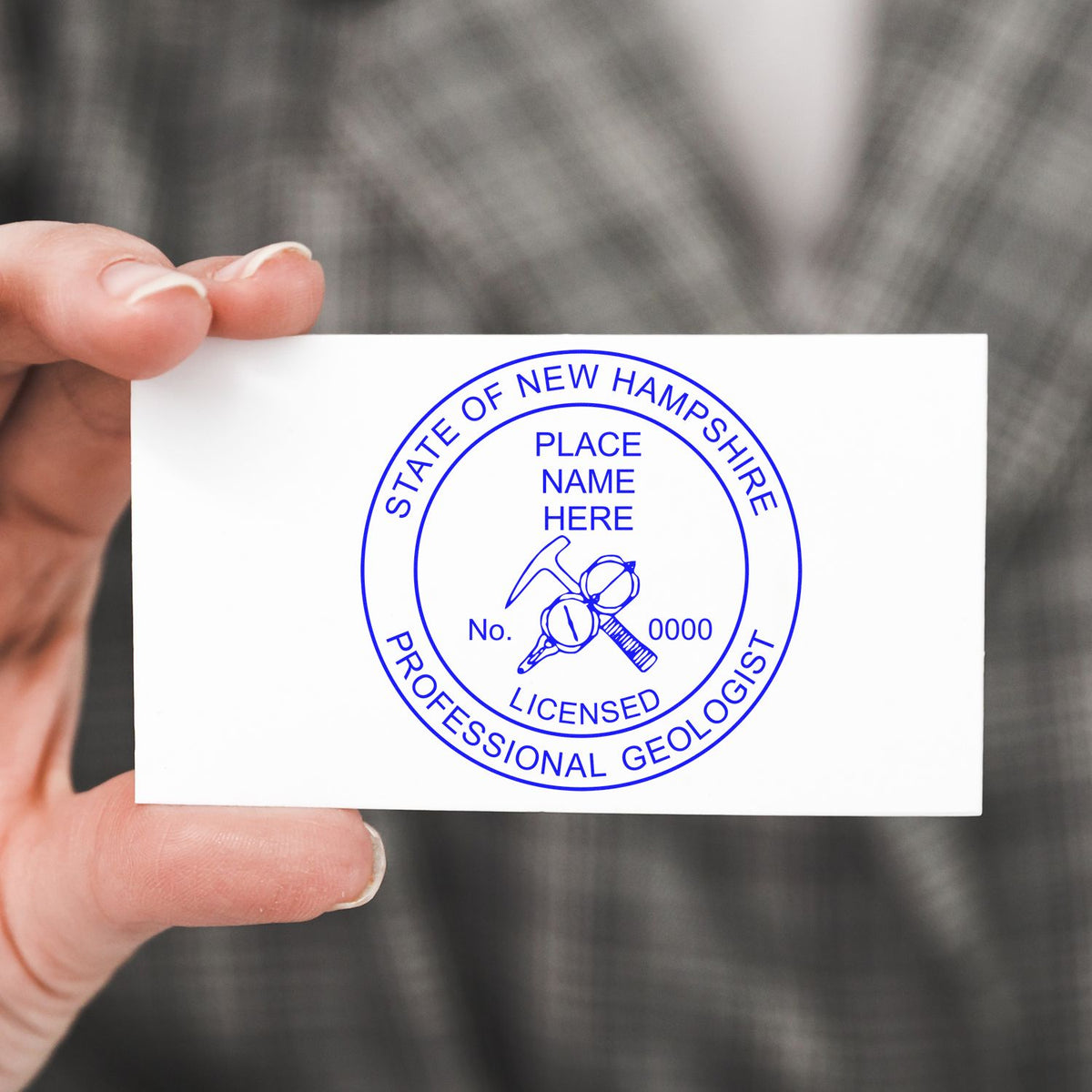 An alternative view of the New Hampshire Professional Geologist Seal Stamp stamped on a sheet of paper showing the image in use