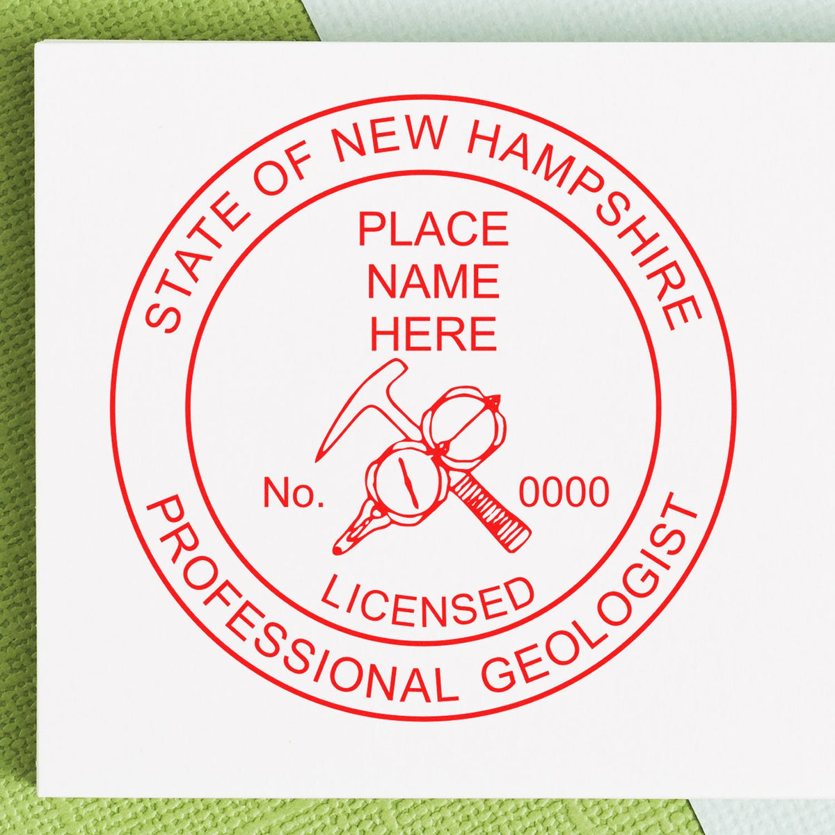 An in use photo of the Slim Pre-Inked New Hampshire Professional Geologist Seal Stamp showing a sample imprint on a cardstock
