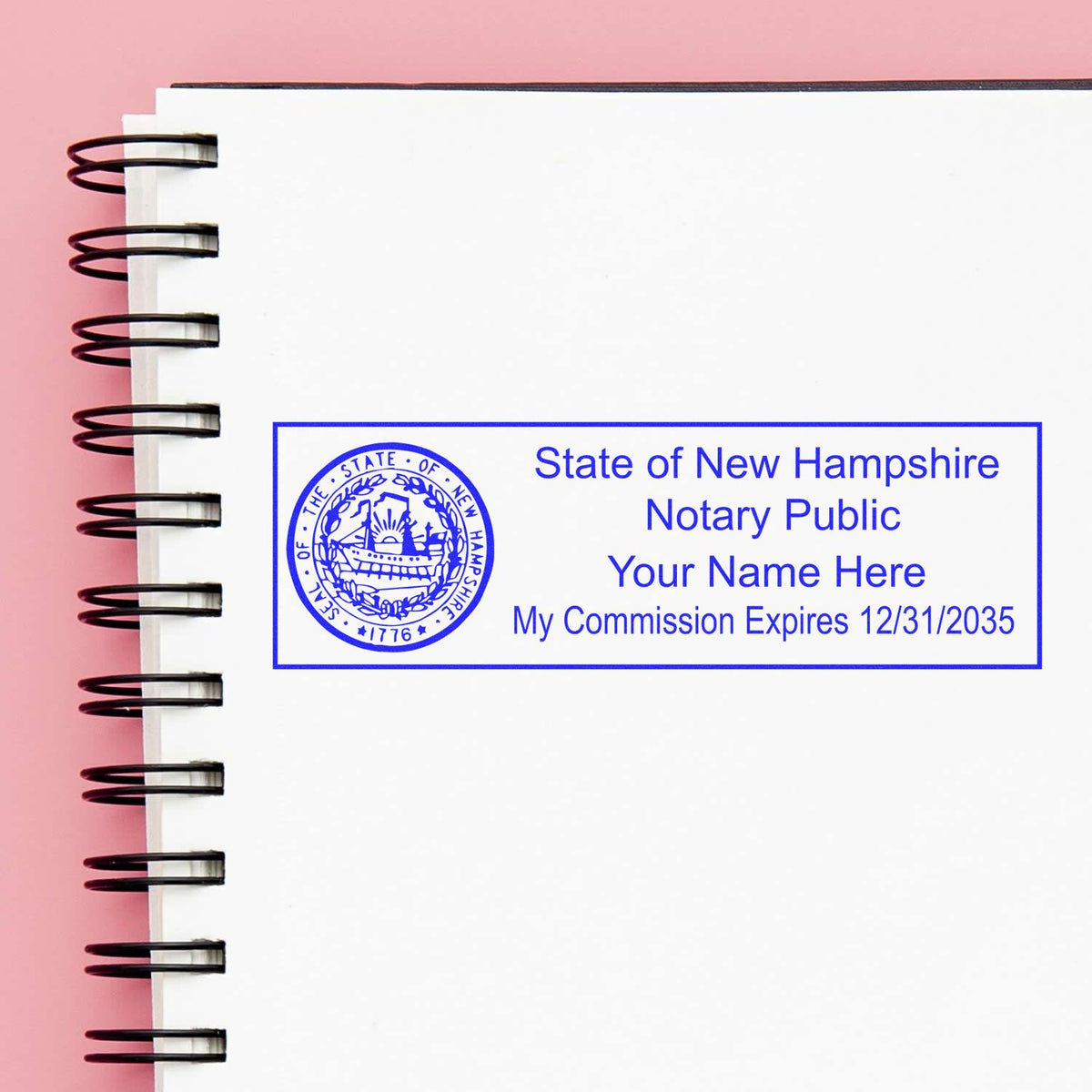 A lifestyle photo showing a stamped image of the Wooden Handle New Hampshire State Seal Notary Public Stamp on a piece of paper