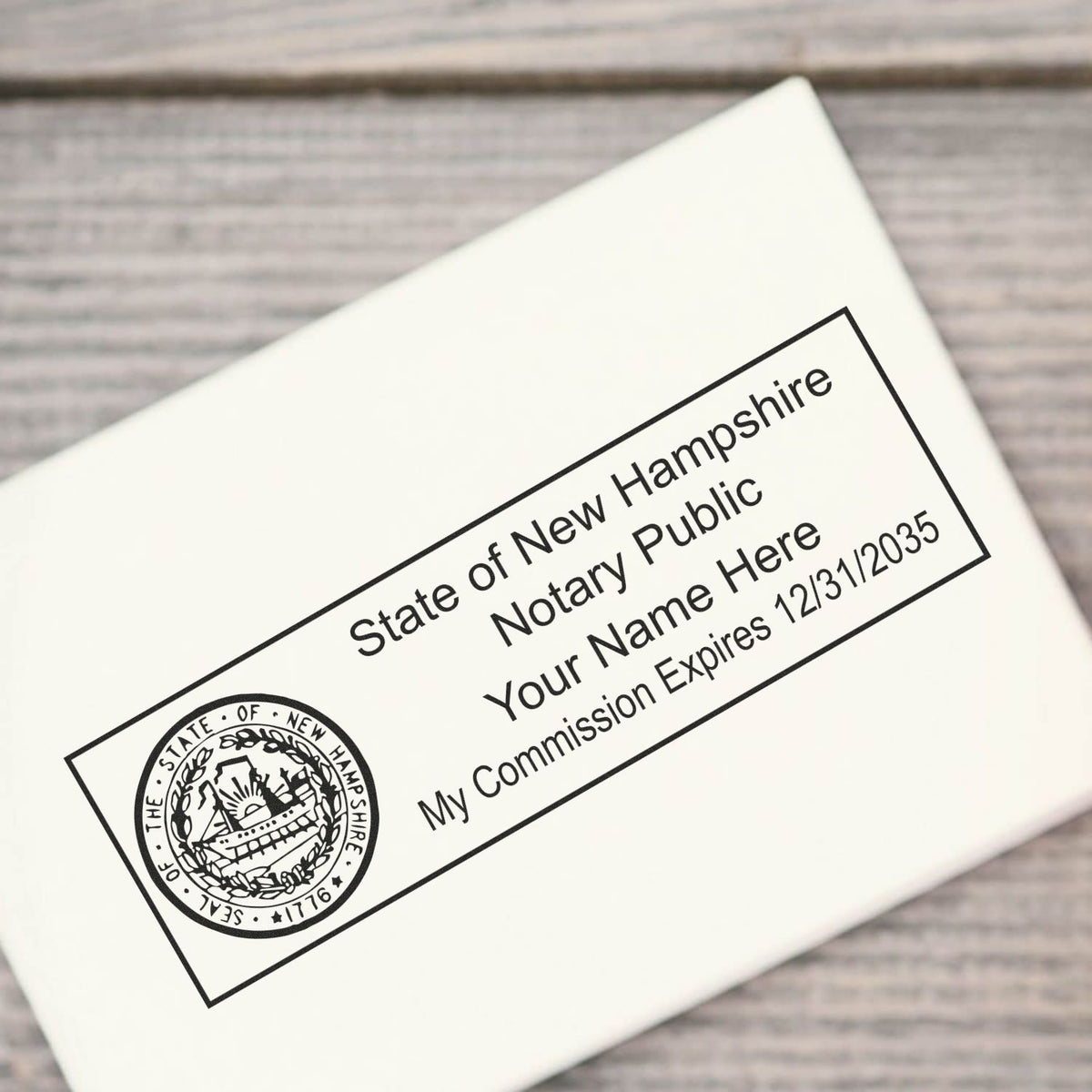 The main image for the Wooden Handle New Hampshire State Seal Notary Public Stamp depicting a sample of the imprint and electronic files