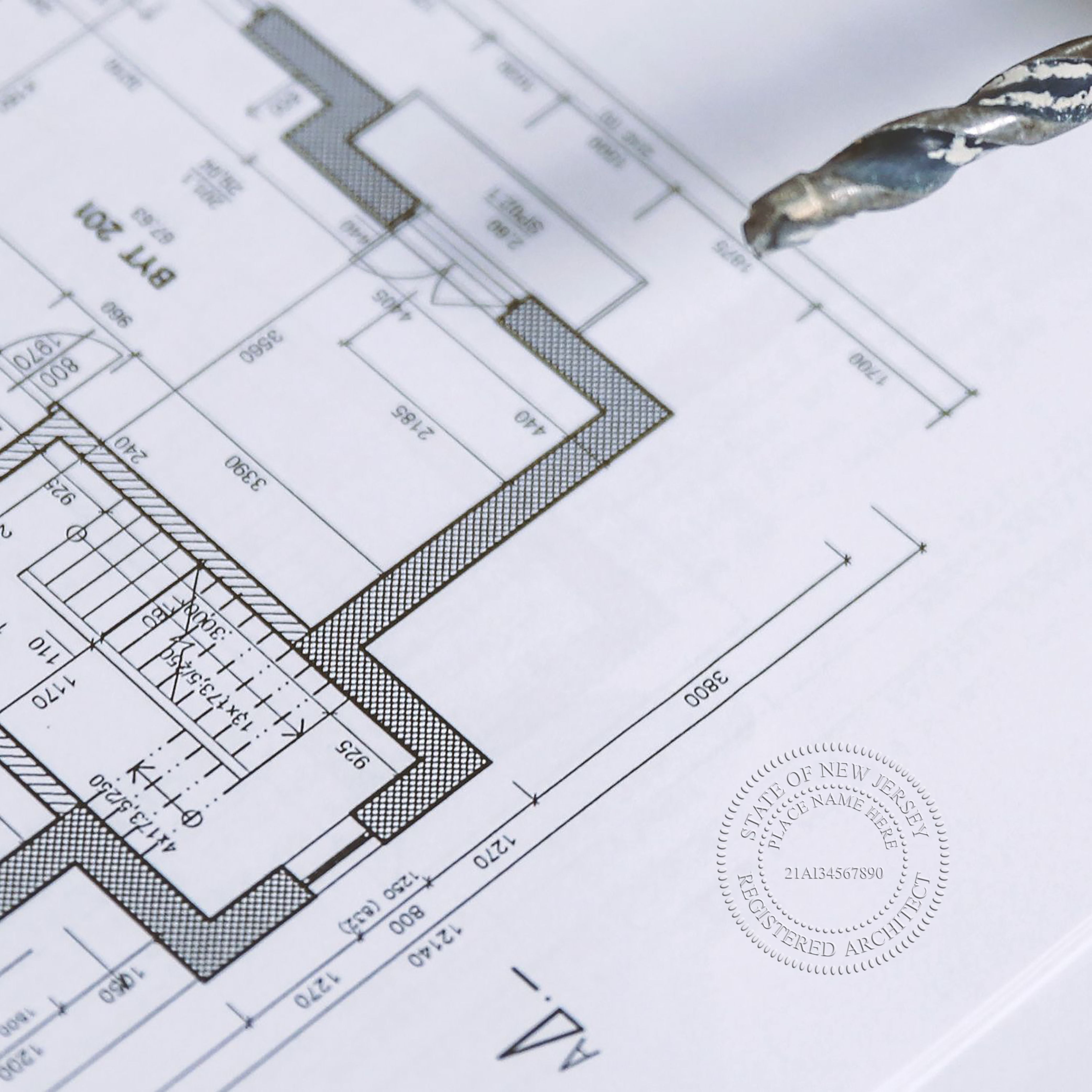 An alternative view of the New Jersey Desk Architect Embossing Seal stamped on a sheet of paper showing the image in use