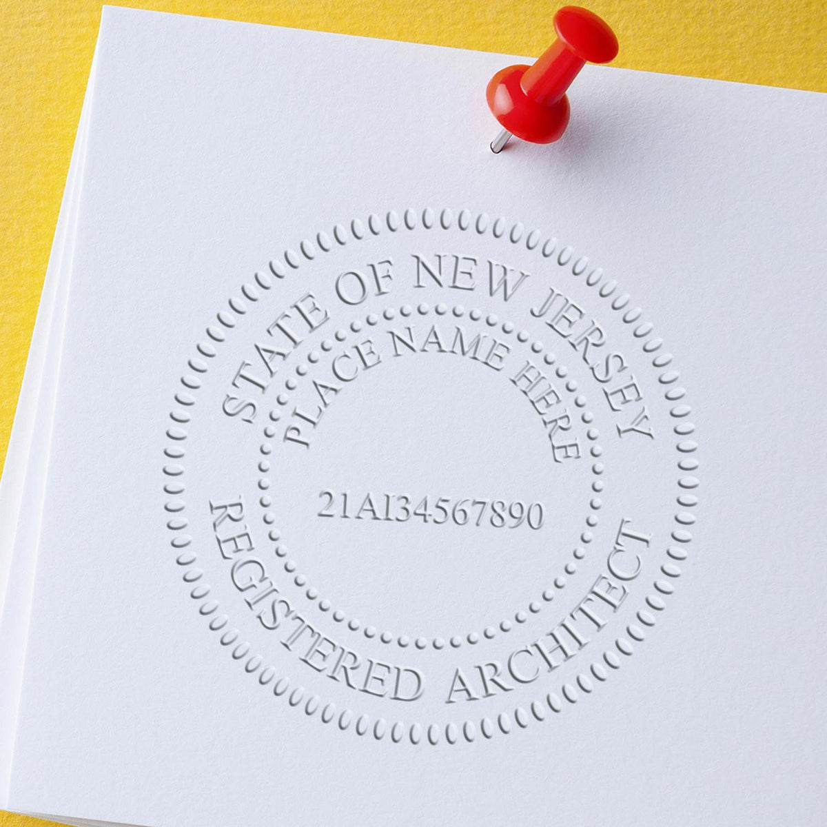 This paper is stamped with a sample imprint of the Extended Long Reach New Jersey Architect Seal Embosser, signifying its quality and reliability.