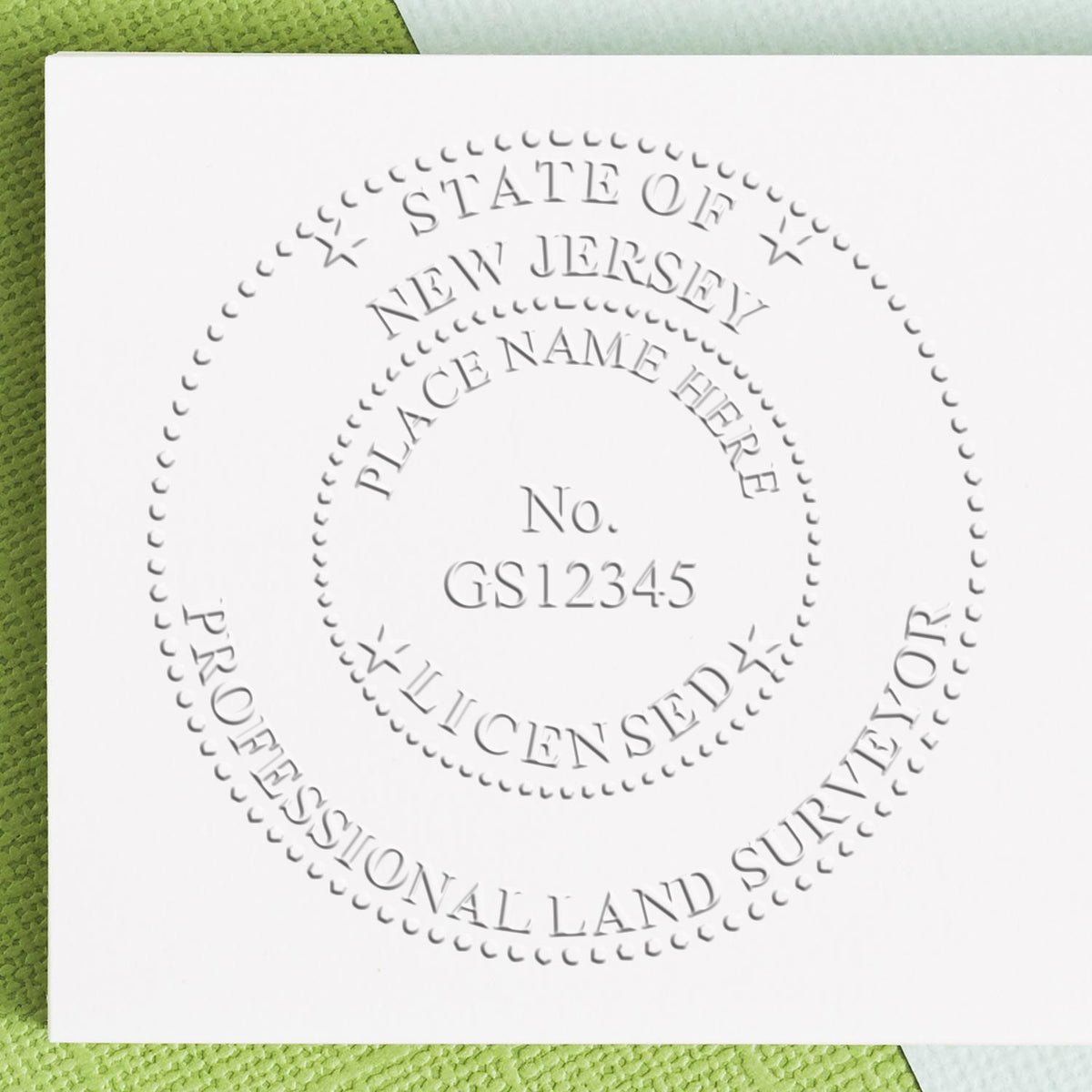 A lifestyle photo showing a stamped image of the State of New Jersey Soft Land Surveyor Embossing Seal on a piece of paper