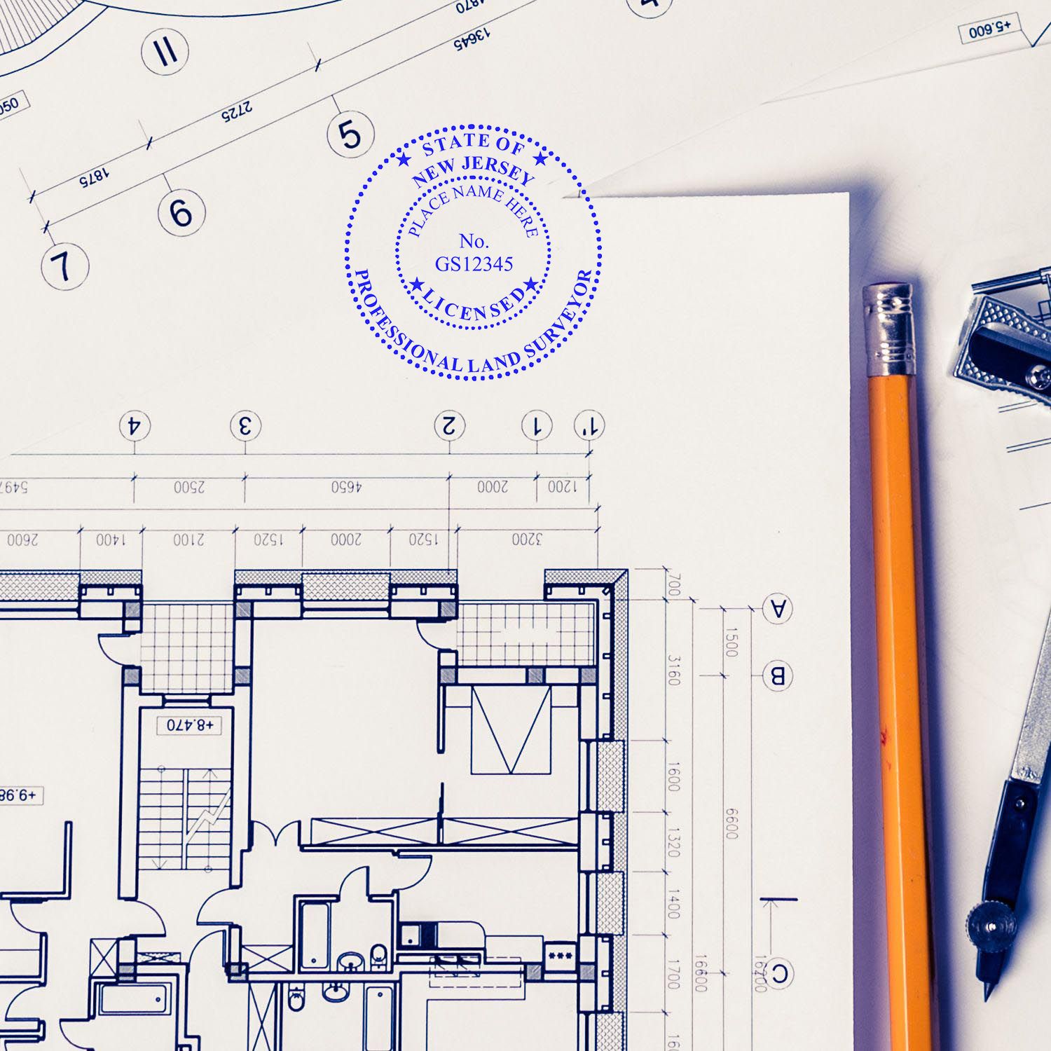 Blueprint with Digital New Jersey Land Surveyor Stamp, Electronic Seal for New Jersey Land Surveyor, pencil, and compass on a desk.