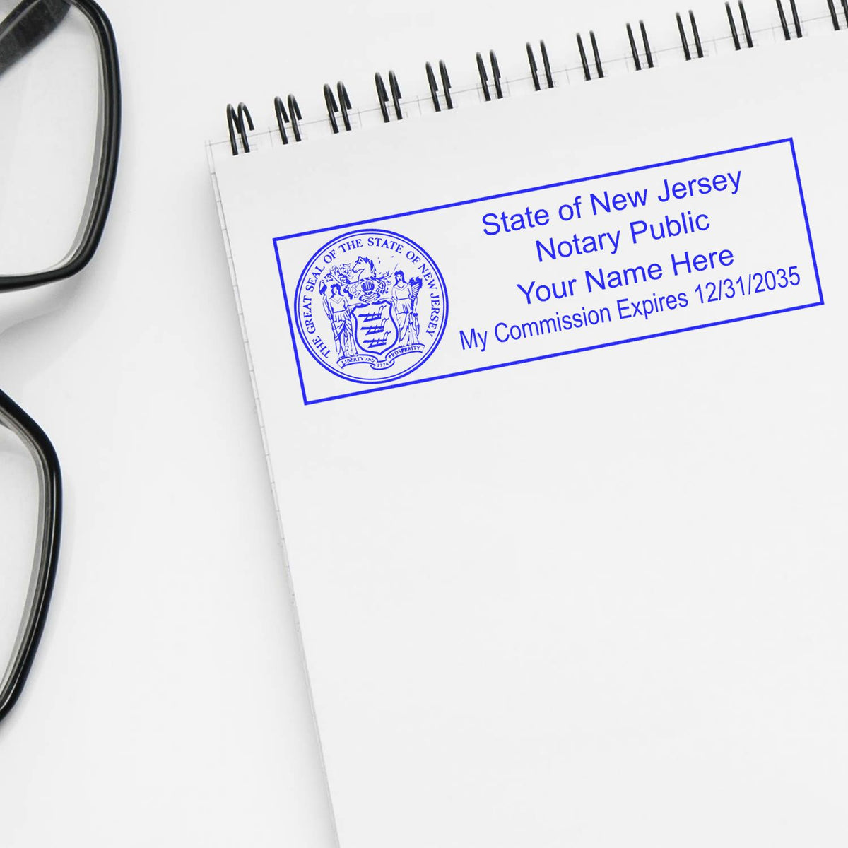 A lifestyle photo showing a stamped image of the Wooden Handle New Jersey State Seal Notary Public Stamp on a piece of paper