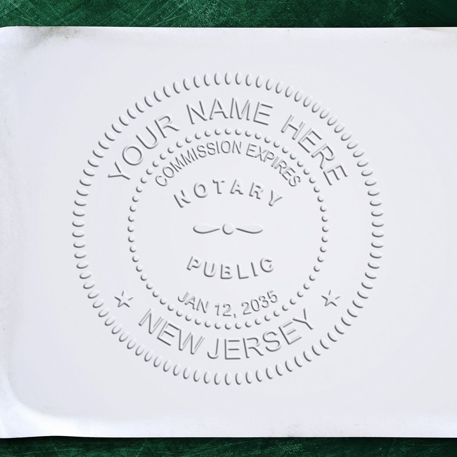 A lifestyle photo showing a stamped image of the New Jersey Handheld Notary Seal Embosser on a piece of paper