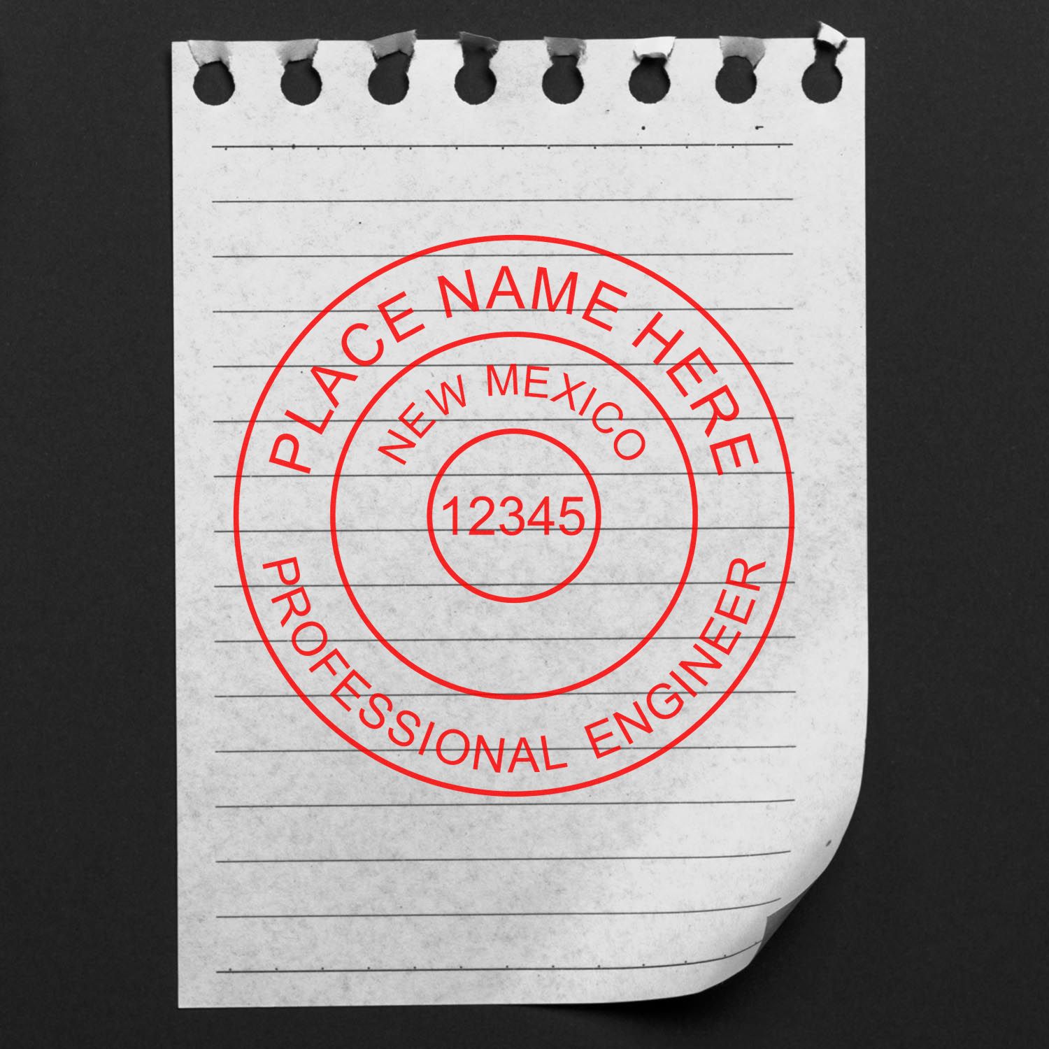 A lifestyle photo showing a stamped image of the New Mexico Professional Engineer Seal Stamp on a piece of paper