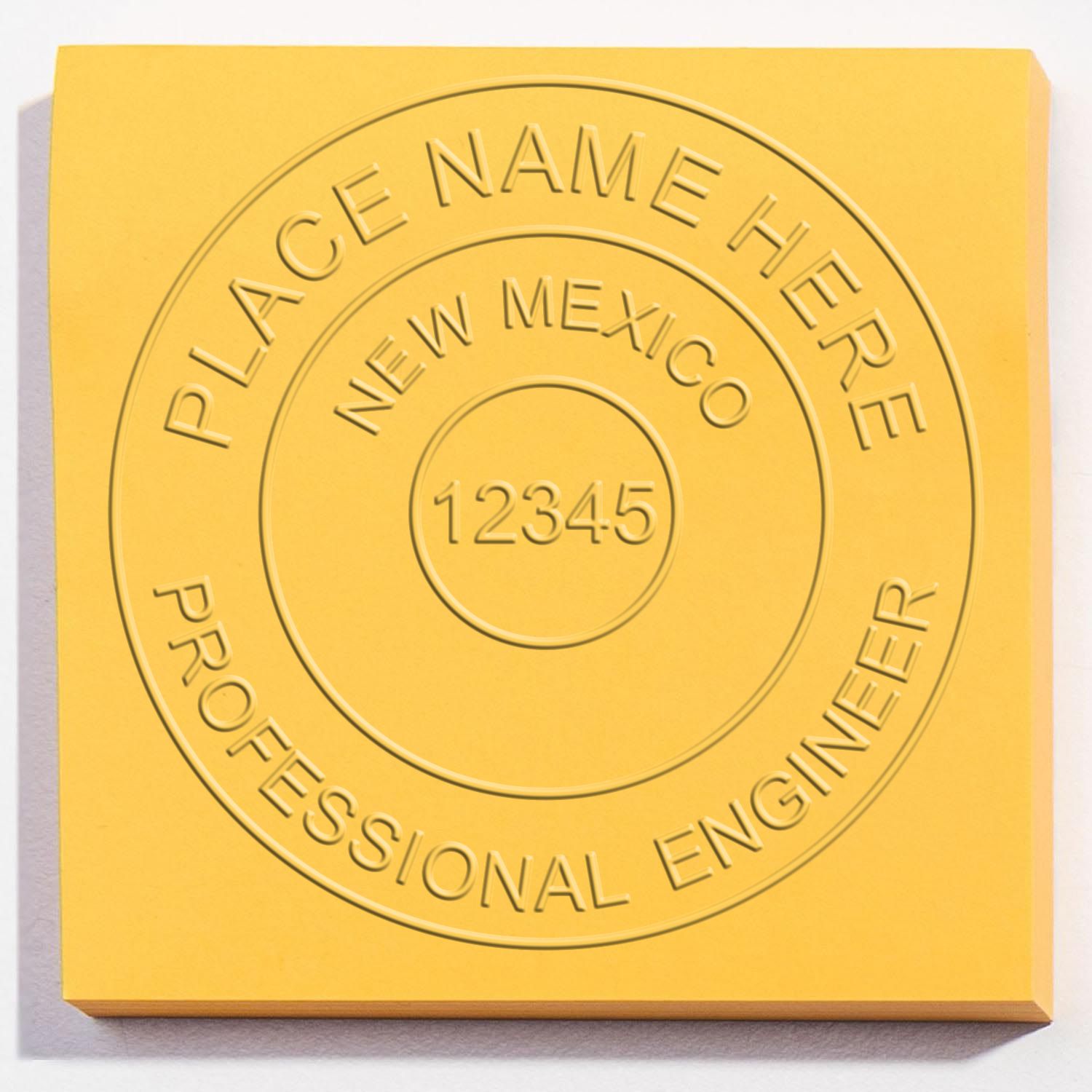 The Gift New Mexico Engineer Seal stamp impression comes to life with a crisp, detailed image stamped on paper - showcasing true professional quality.