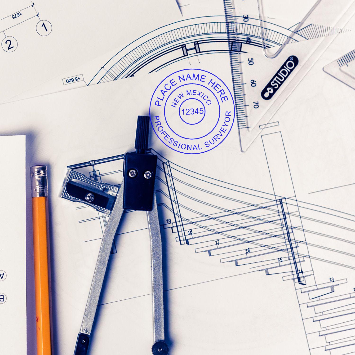 Digital New Mexico Land Surveyor Stamp, Electronic Seal for New Mexico Land Surveyor on architectural blueprints with drafting tools.