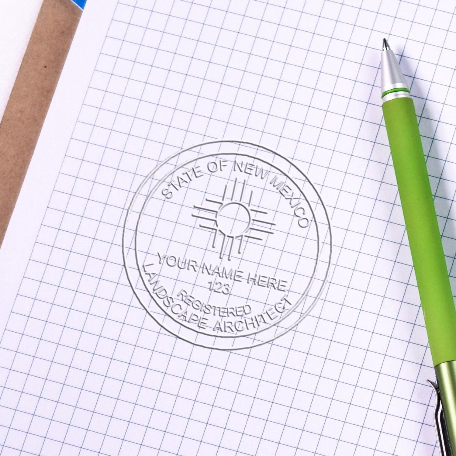 An alternative view of the Gift New Mexico Landscape Architect Seal stamped on a sheet of paper showing the image in use