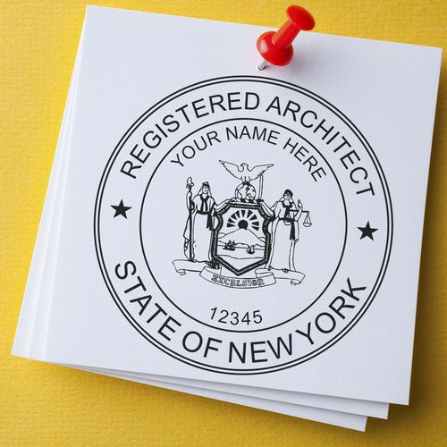 Self Inking New York Architect Stamp on white paper with a red pushpin, featuring a circular design with Registered Architect State of New York.