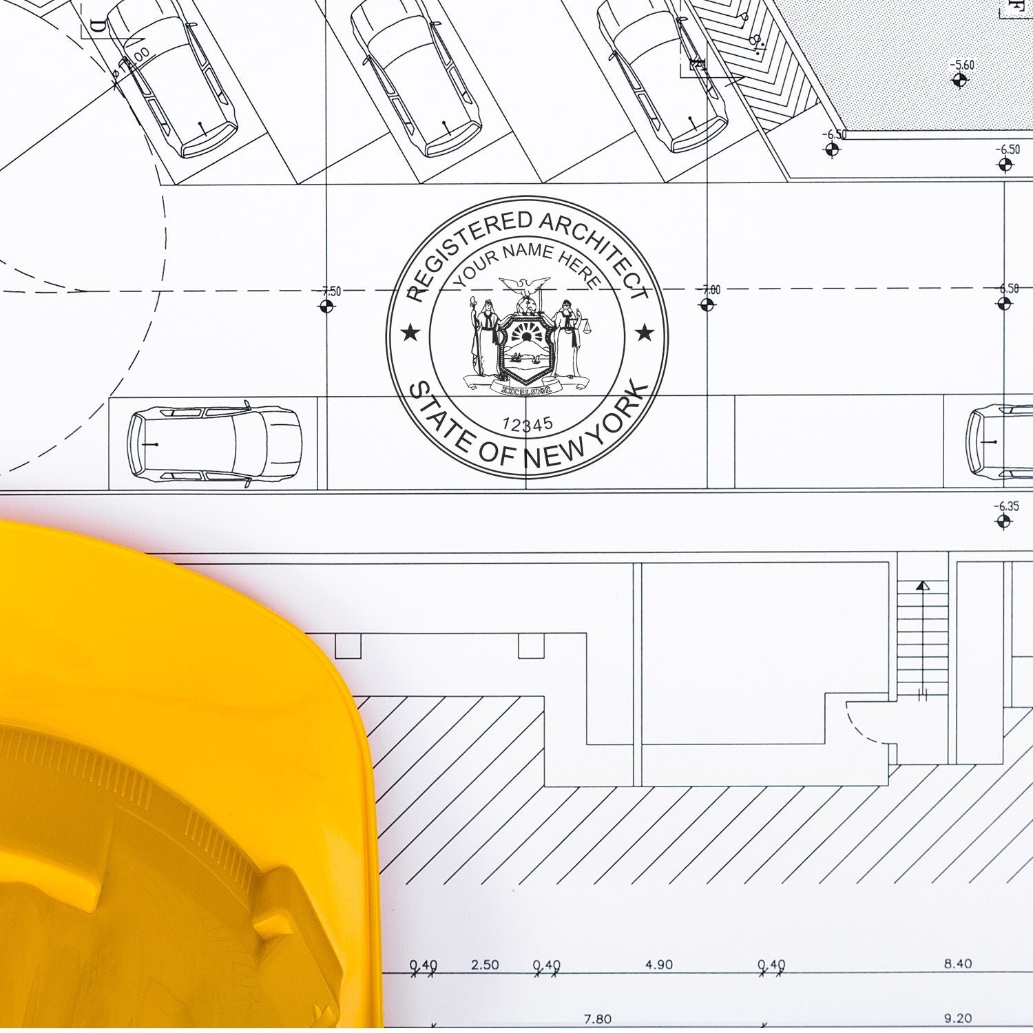 Self Inking New York Architect Stamp in use on architectural blueprints, with a yellow hard hat in the foreground.