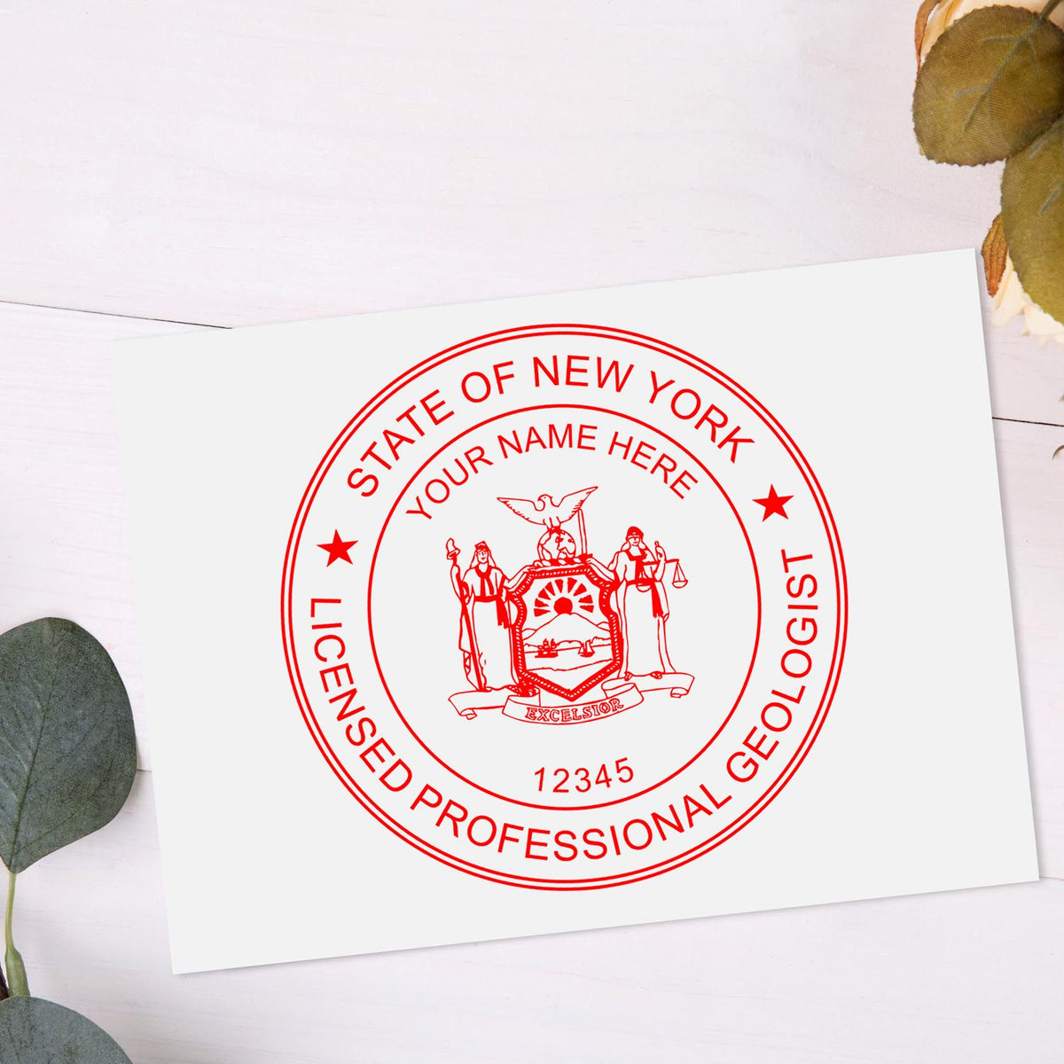 An in use photo of the Premium MaxLight Pre-Inked New York Geology Stamp showing a sample imprint on a cardstock