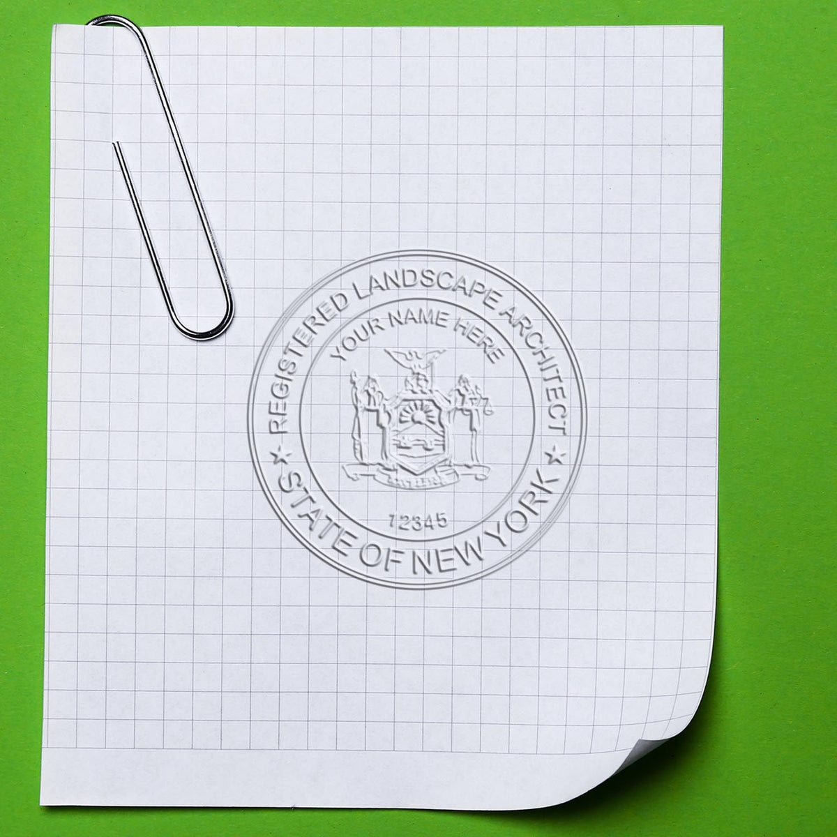 An in use photo of the Gift New York Landscape Architect Seal showing a sample imprint on a cardstock