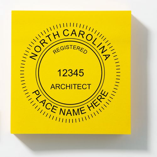 A lifestyle photo showing a stamped image of the Slim Pre-Inked North Carolina Architect Seal Stamp on a piece of paper