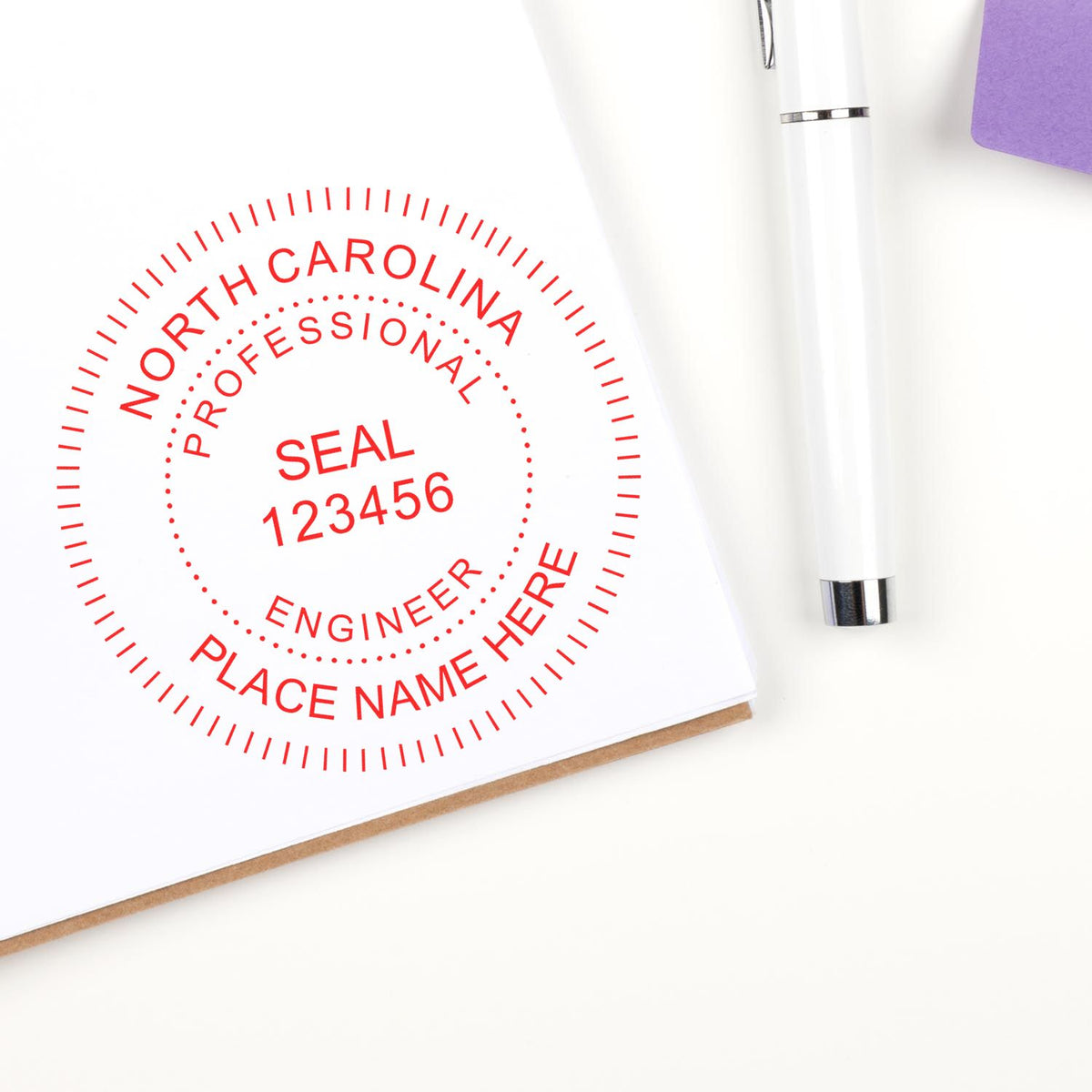 A lifestyle photo showing a stamped image of the North Carolina Professional Engineer Seal Stamp on a piece of paper