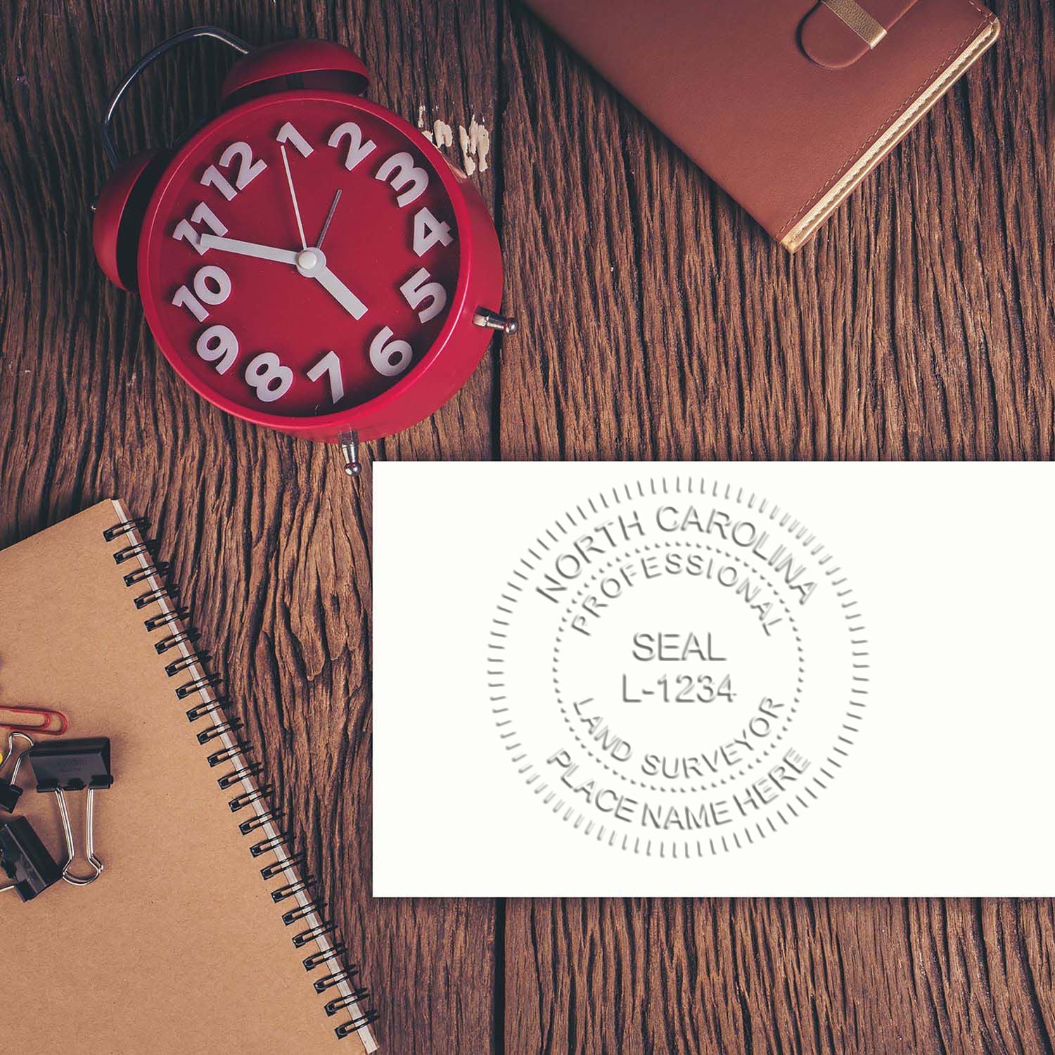 A photograph of the North Carolina Desk Surveyor Seal Embosser stamp impression reveals a vivid, professional image of the on paper.