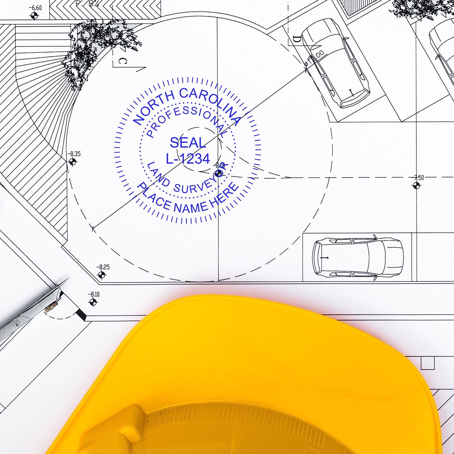 North Carolina Land Surveyor Seal Stamp, NC PLS Stamp, on a blueprint with a yellow hard hat and a pen nearby.
