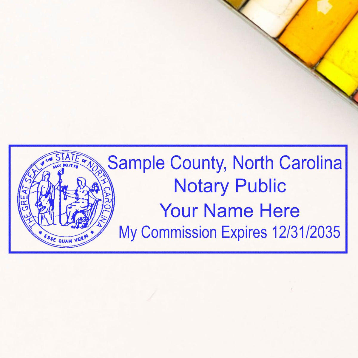 A lifestyle photo showing a stamped image of the Wooden Handle North Carolina State Seal Notary Public Stamp on a piece of paper